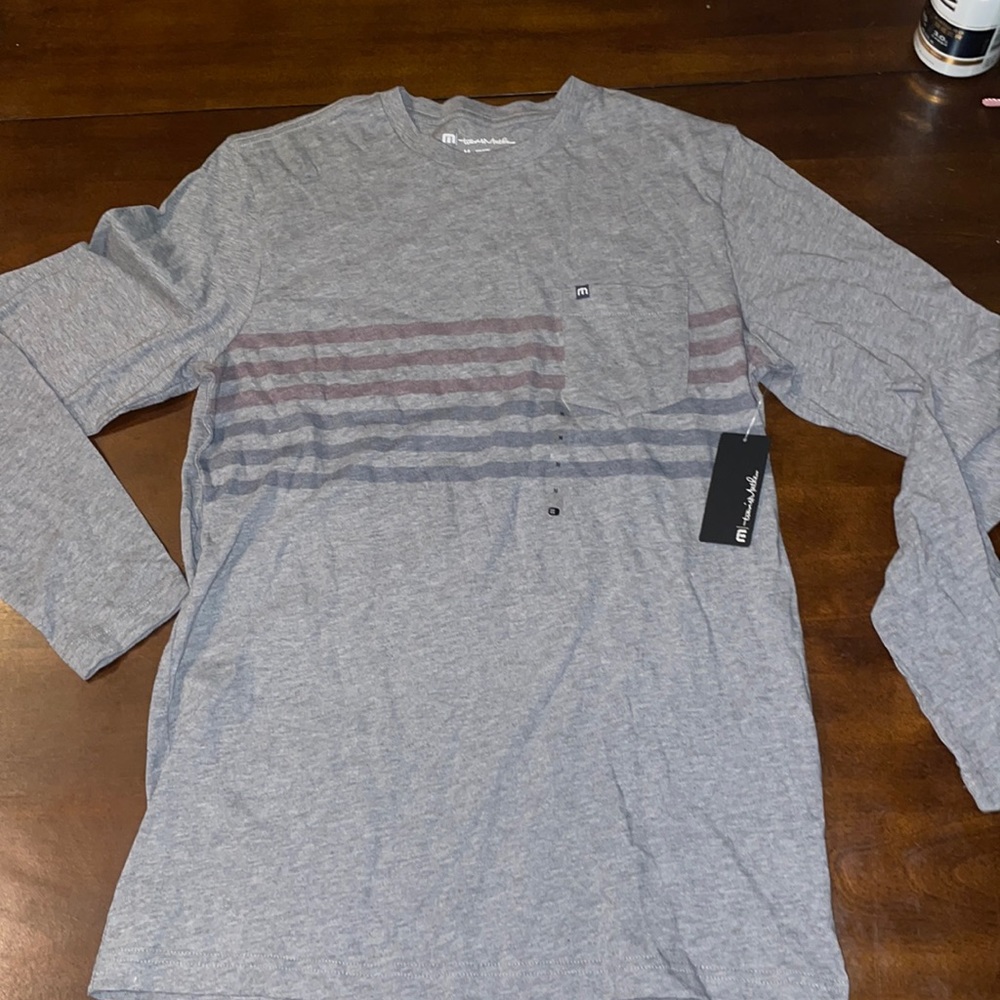 Medium Travis Matthew’s long sleeve tee. Never worn